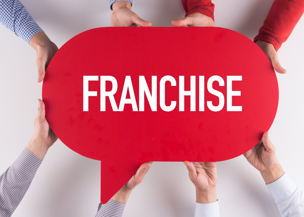 Group of People Holding Franchise bubble word