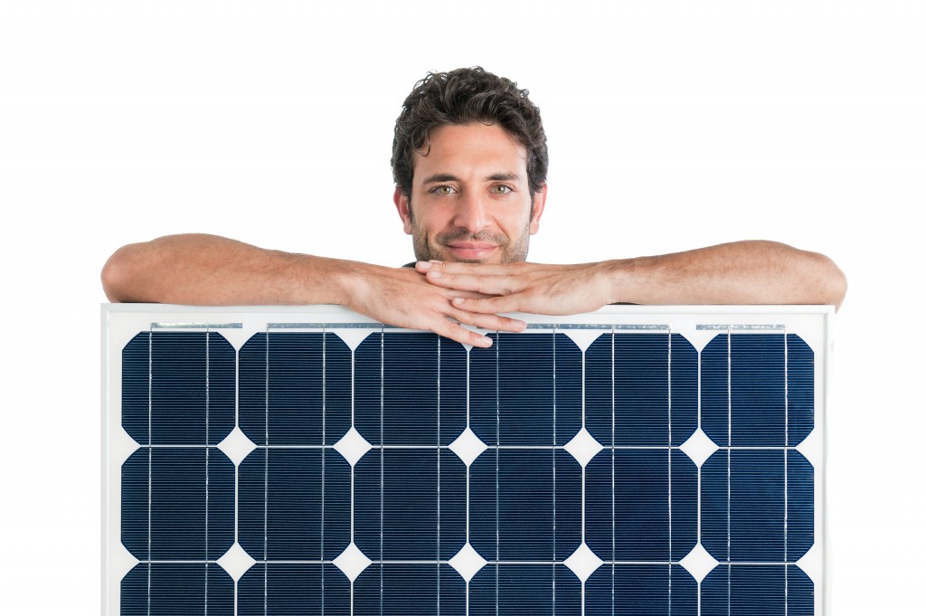 man holding a solar panel