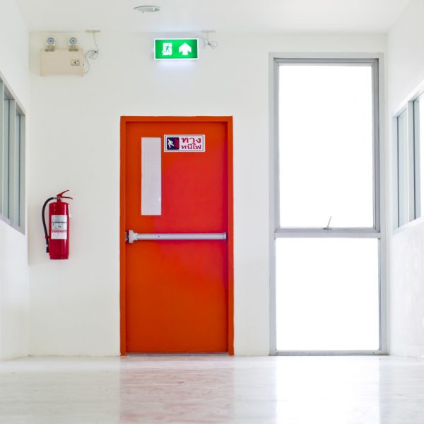 Building Emergency Exit with Exit Sign and Fire Extinguisher